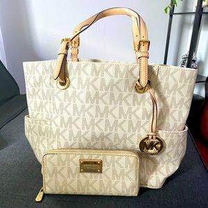 Michael kors tote bag with matching wallet.